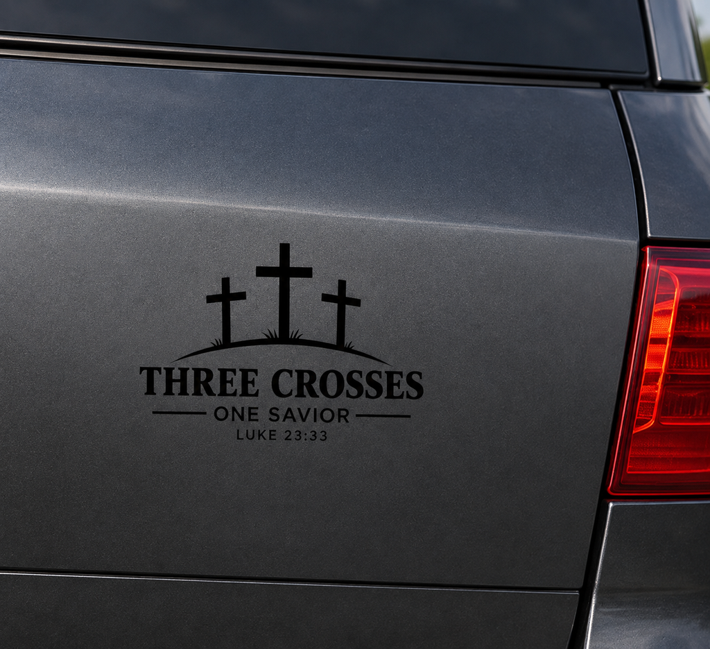 Three Crosses One Savior Christian vinyl decal in white displayed on a dark grey vehicle body panel.