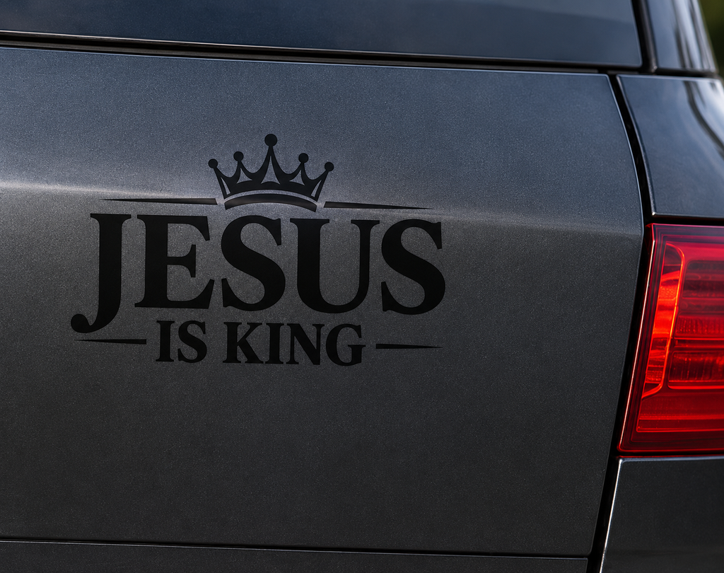 Close-up of Jesus Is King Christian vinyl decal on a dark vehicle