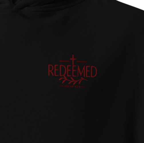 Close-up of black Redeemed Isaiah 43:1 premium embroidered Christian hoodie with red chest embroidery.