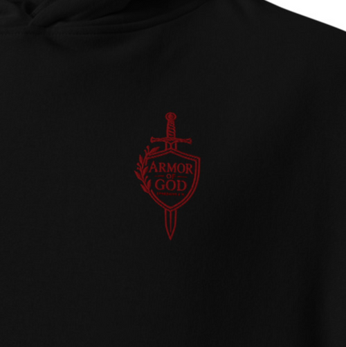 Close-up of black Armor of God Ephesians 6:11 premium embroidered Christian hoodie with red shield and sword chest embroidery.