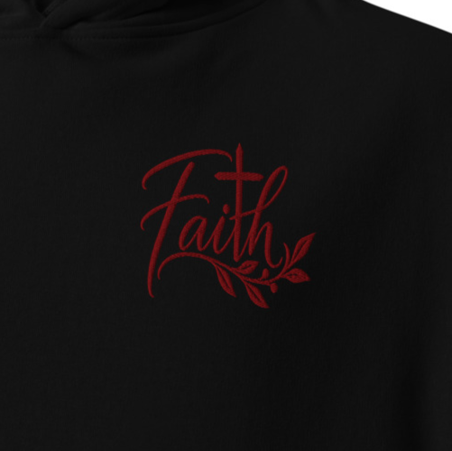 Close-up of black Faith premium embroidered Christian hoodie with red cross and botanical chest embroidery.