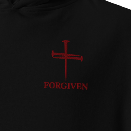 Close-up of black Forgiven premium embroidered Christian hoodie with red cross and chest embroidery.