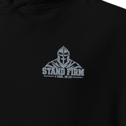 Close-up of black Stand Firm 1 Corinthians 16:13 premium embroidered Christian hoodie with silver knight chest embroidery.