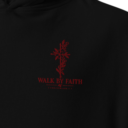 Close-up of black Walk by Faith 2 Corinthians 5:7 premium embroidered Christian hoodie with red floral cross chest embroidery.