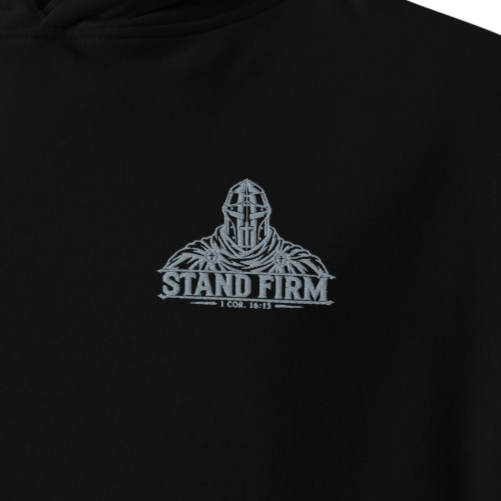 Close-up of black Stand Firm 1 Corinthians 16:13 premium embroidered Christian hoodie with silver crusader knight chest embroidery.