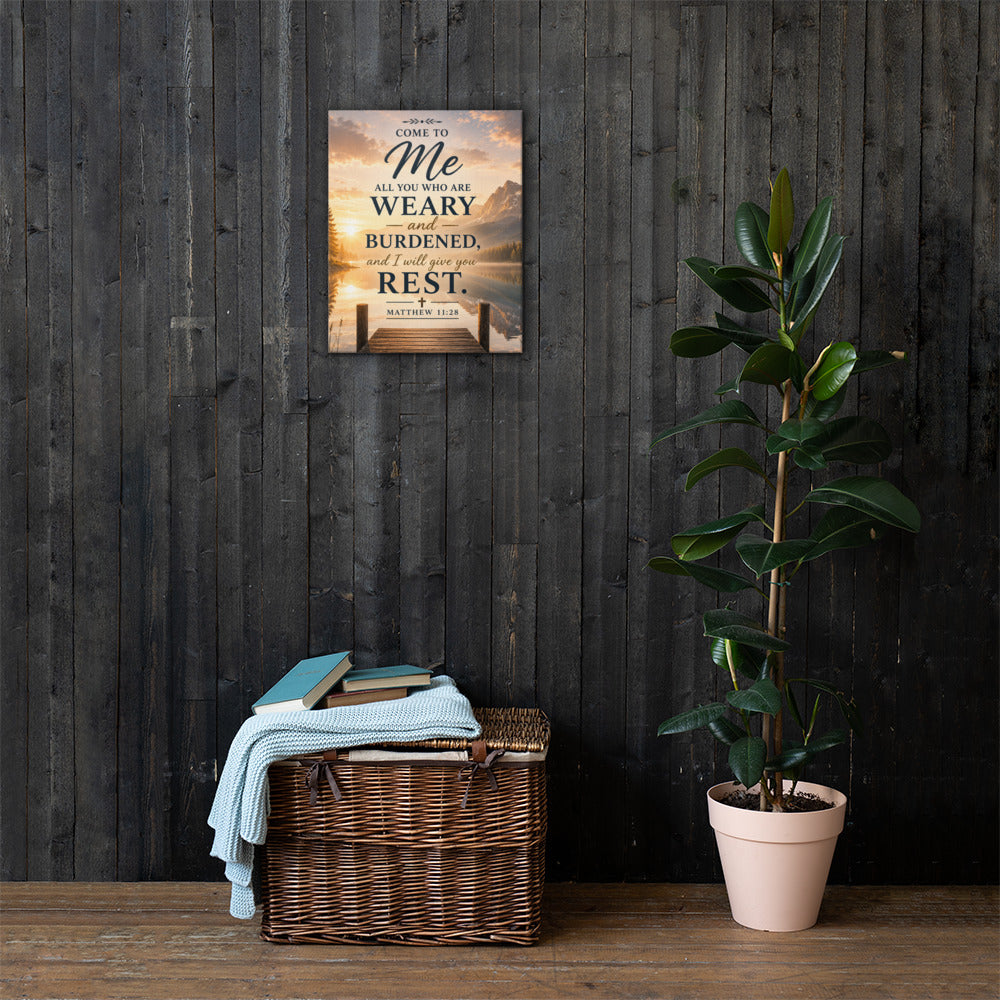 Matthew 11:28 Christian canvas wall art displayed on dark wood wall with plant and rustic home decor