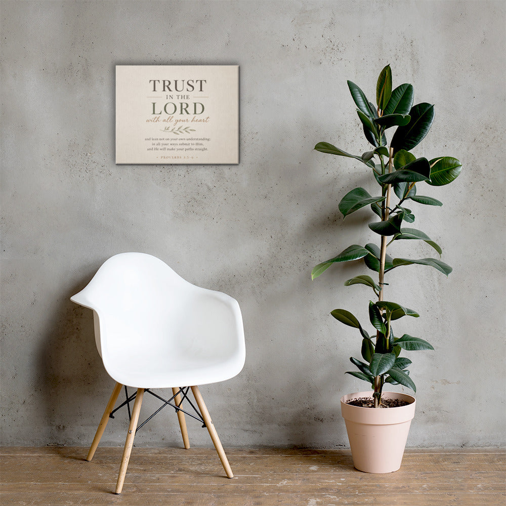 Proverbs 3:5–6 Christian wall art displayed in bright neutral interior with chair and houseplant