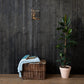 For God So Loved the World Christian cross canvas displayed small on dark wood wall