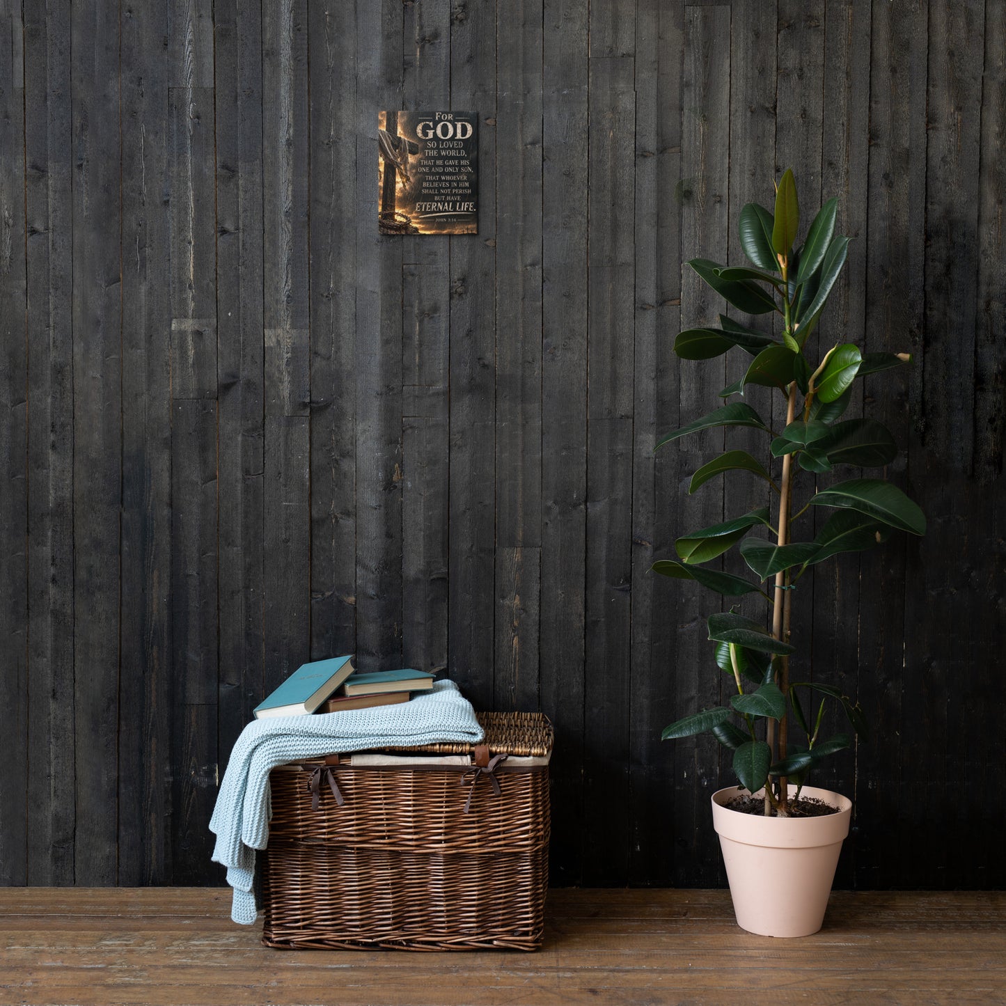For God So Loved the World Christian cross canvas displayed small on dark wood wall