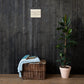 Walk by Faith Not by Sight Scripture canvas displayed on dark wood wall above basket and plant
