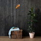 Chariot and Horses of Fire Scripture canvas displayed on dark wood wall above basket and plant