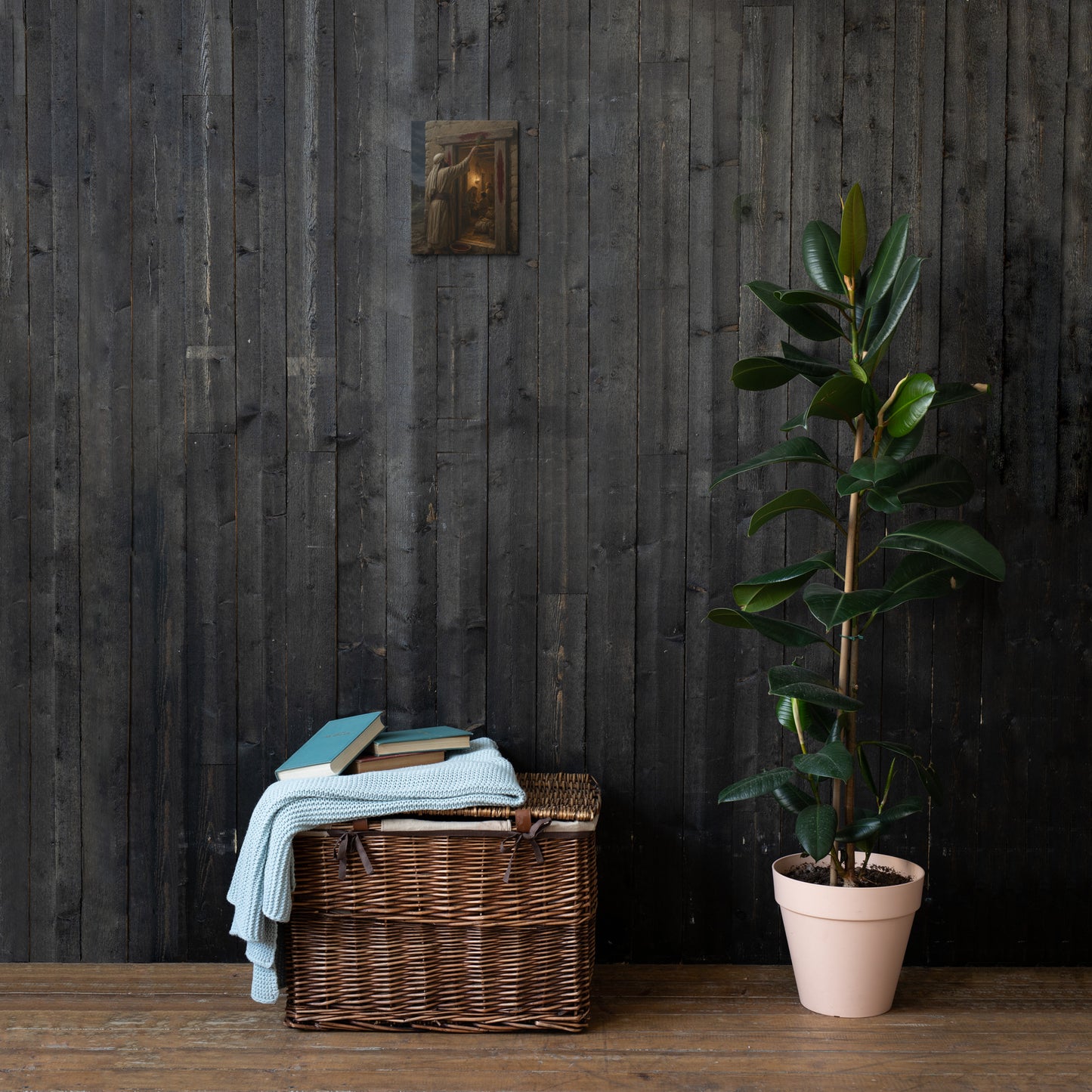 Exodus 12 hyssop and Passover doorway canvas displayed on dark wood wall above basket and plant