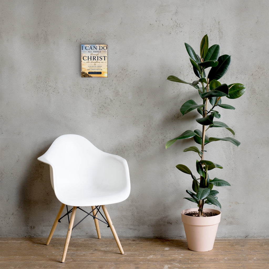 Philippians 4:13 Bible verse canvas displayed beside white chair and green plant