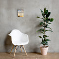 Philippians 4:13 Bible verse canvas displayed beside white chair and green plant