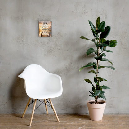 Matthew 11:28 Bible verse canvas displayed beside white chair and green plant