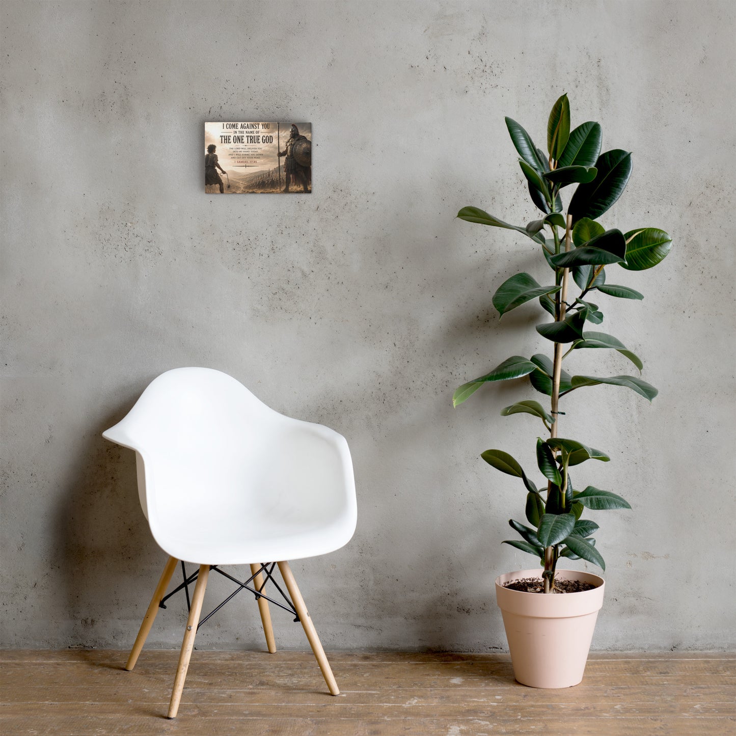 1 Samuel 17:45 David and Goliath canvas displayed beside white chair and green plant