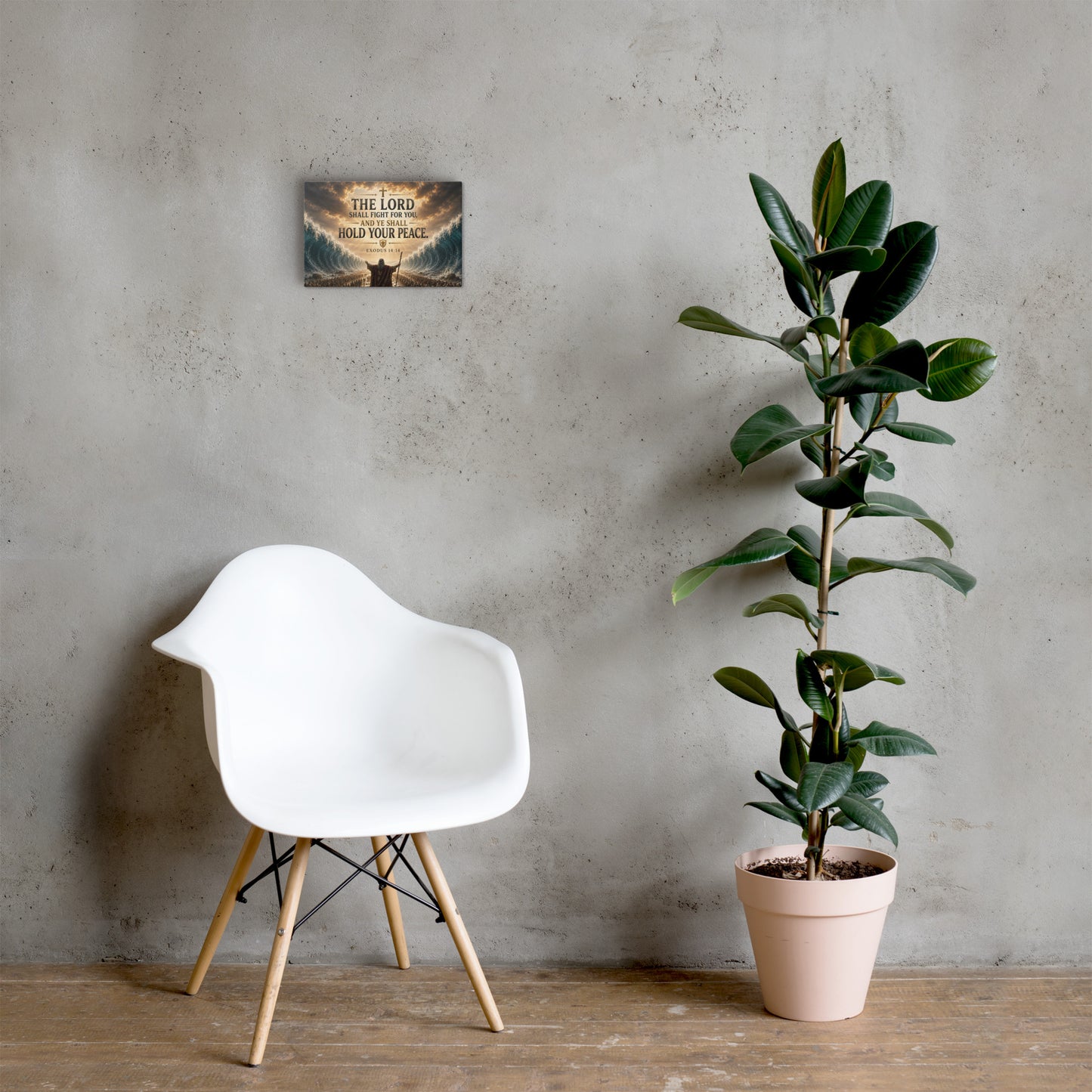 The Lord Shall Fight for You Christian canvas displayed beside white chair and green plant