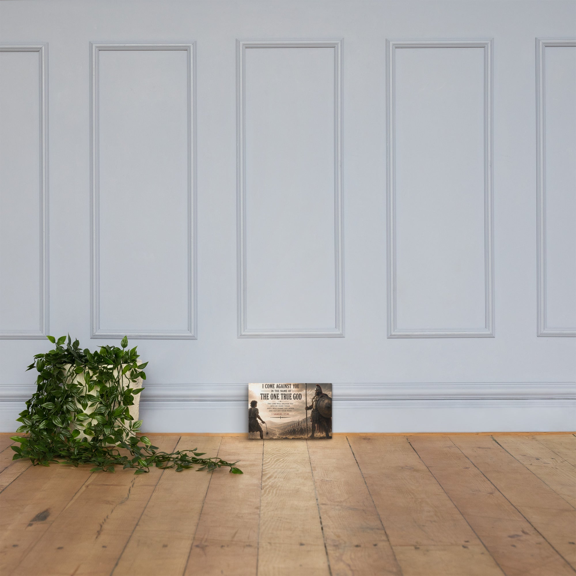 David and Goliath Bible verse canvas displayed on grey paneled wall