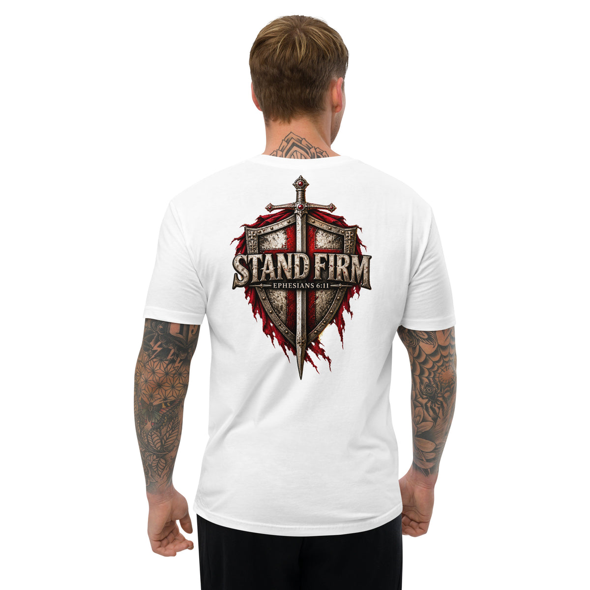 Man wearing white Ephesians 6:11 shirt with large medieval shield sword and cross graphic
