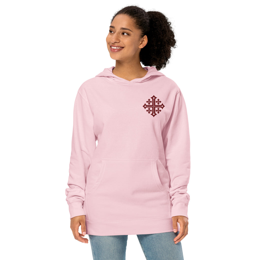 Female model in Light Pink women’s Christian hoodie featuring maroon Jerusalem Cross emblem